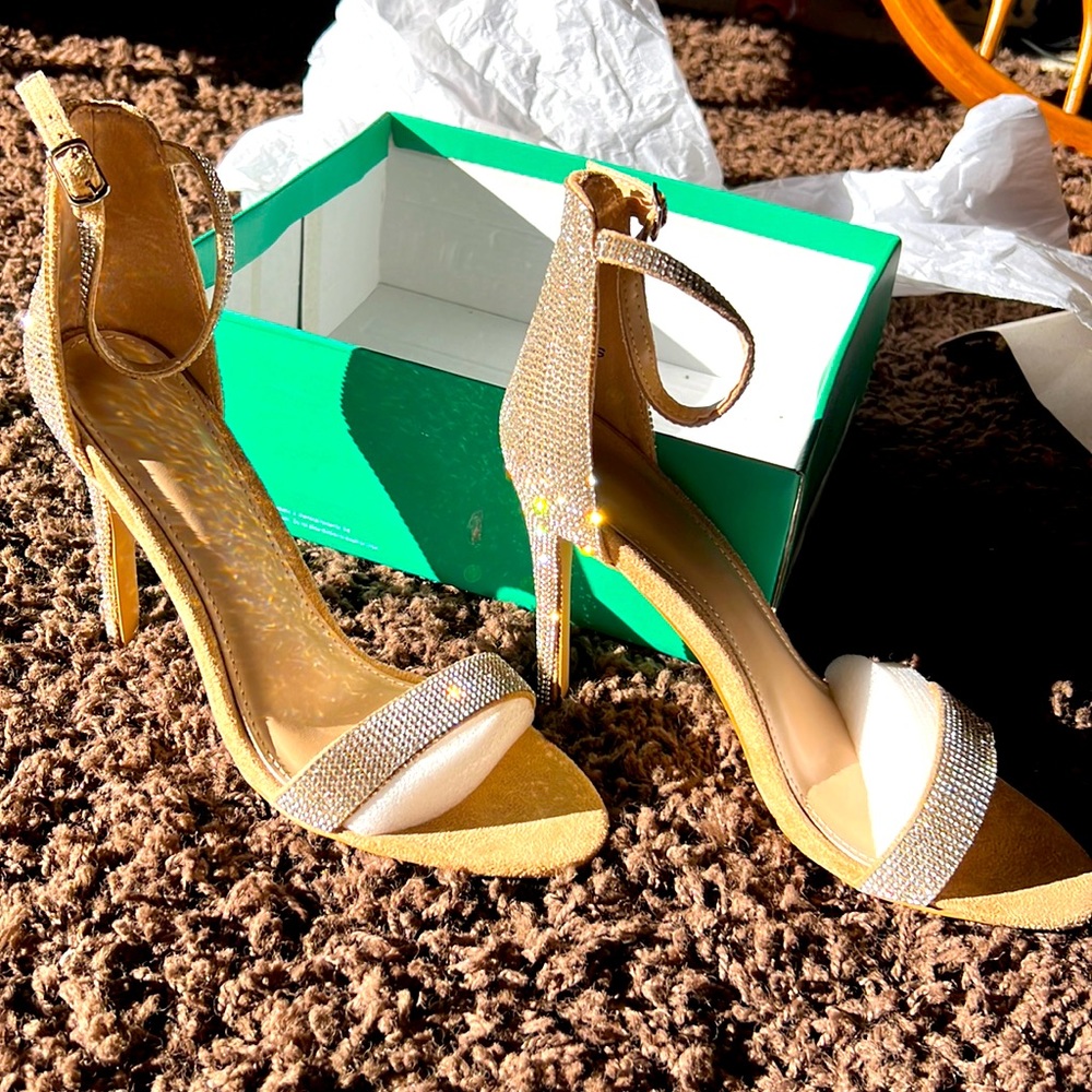 Brand new, Never worn rhinestone heels. 4 inch heel. Size 8.5